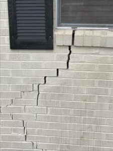 Brick wall cracks caused by foundation issues in Tyler, TX home