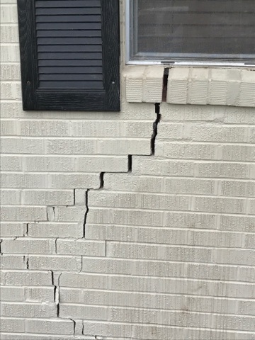 Brick wall cracks caused by foundation issues in Tyler, TX home