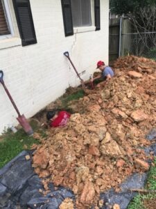 Foundation repair crew working on slab repair in Tyler, TX