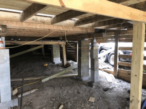 Crawl space pier and beam foundation repair with new concrete block supports in Tyler TX