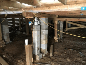 Crawl space pier and beam foundation repair with new concrete block supports in Tyler TX