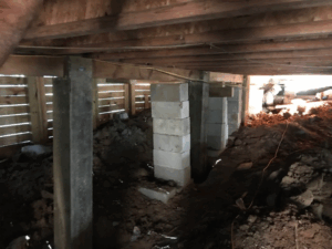 Crawl space pier and beam foundation repair with new concrete block supports in Tyler TX