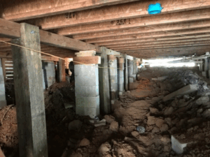 Crawl space pier and beam foundation repair with new concrete block supports in Tyler TX