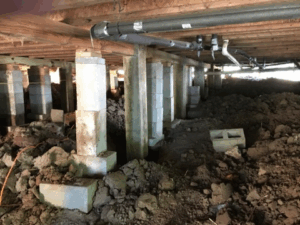 Crawl space pier and beam foundation repair with new concrete block supports in Tyler TX