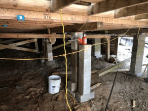 Crawl space pier and beam foundation repair with new concrete block supports in Tyler TX