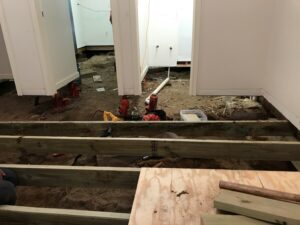 Open floor foundation repair with flooring removed inside Tyler TX home