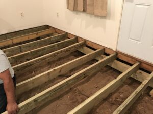 Open floor foundation repair with flooring removed inside Tyler TX home