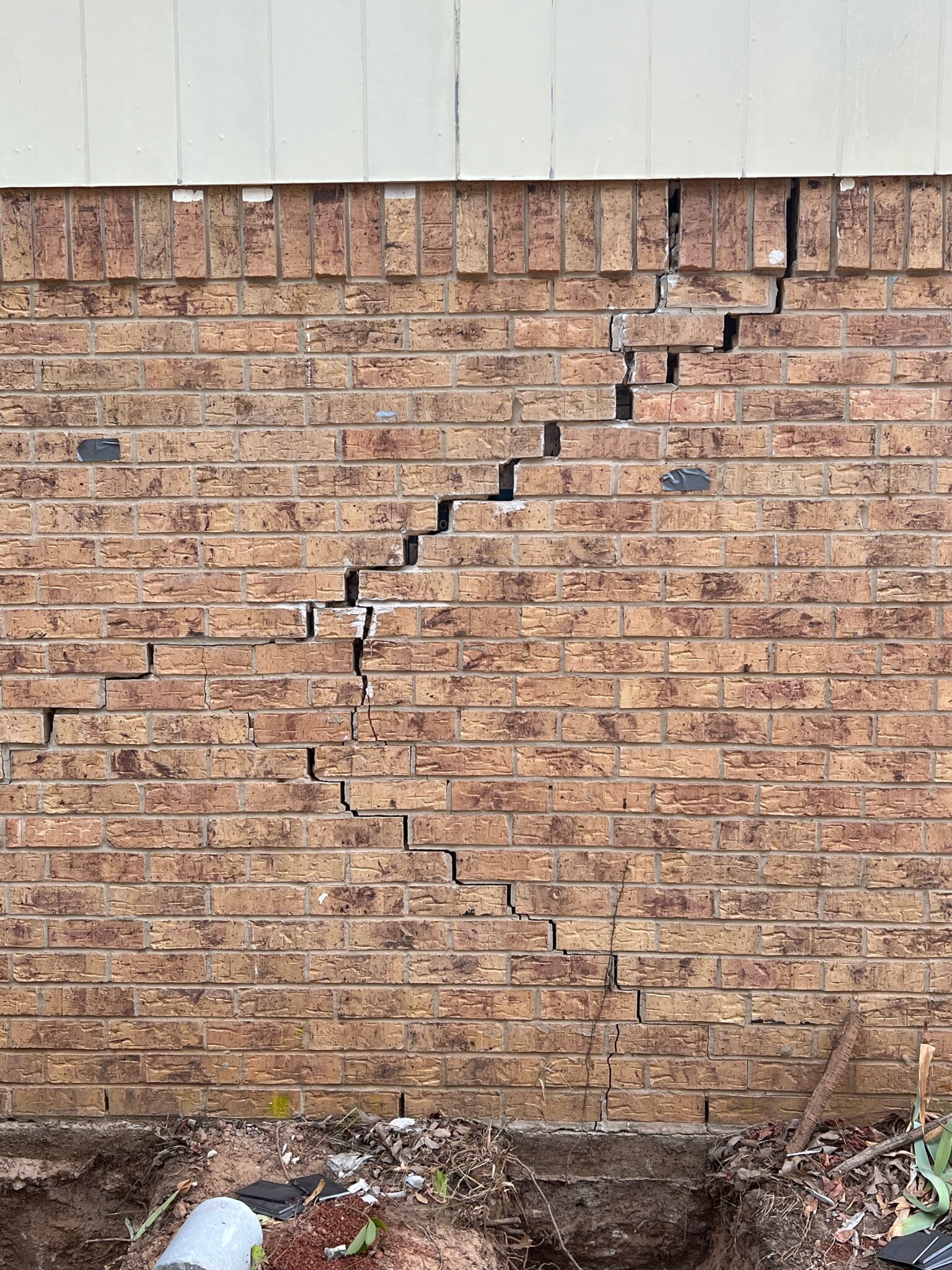 Brick wall cracks caused by foundation issues in Tyler, TX home