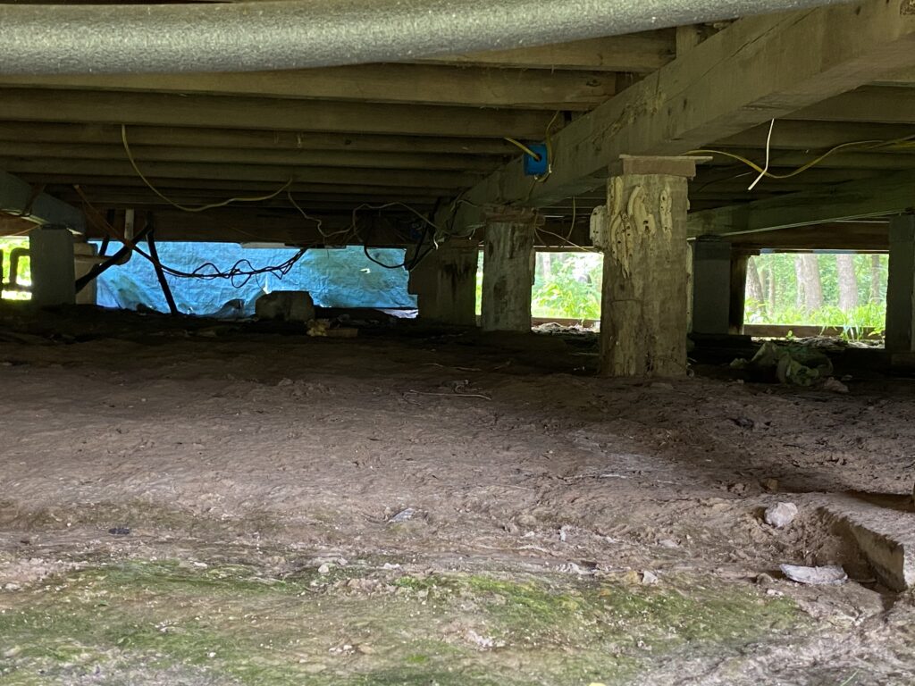 Pier and beam foundation repair under a home in East Texas