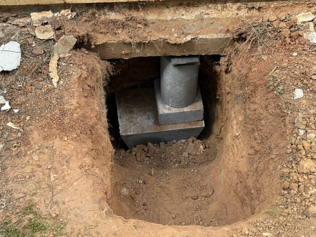 Pier and beam foundation repair under a home in East Texas